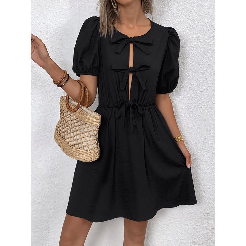 Women's striped tie-front puff sleeve mini dress from Plush Fashion Hub, casualwear with a stylish front tie and puff sleeves.