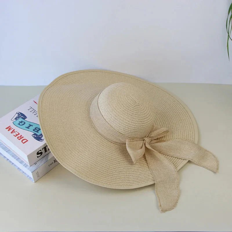 Women’s summer straw hat with wide brim and adjustable band, stylish hat from Plush Fashion Hub for sun protection and fashion.