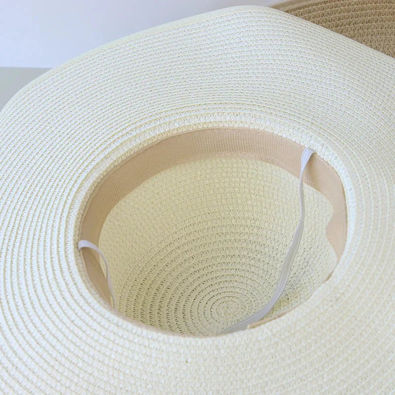 Women’s summer straw hat from Plush Fashion Hub with wide brim and woven design, perfect for sunny outdoor activities.