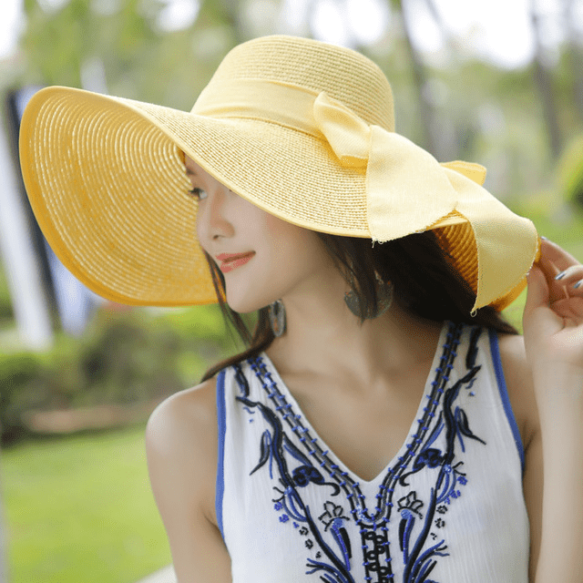 Women’s summer straw hat by Plush Fashion Hub featuring a wide brim and breathable woven design for sun protection.
