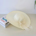 Women’s summer straw hat from Plush Fashion Hub with wide brim and breathable woven design, perfect for sunny outdoor days.