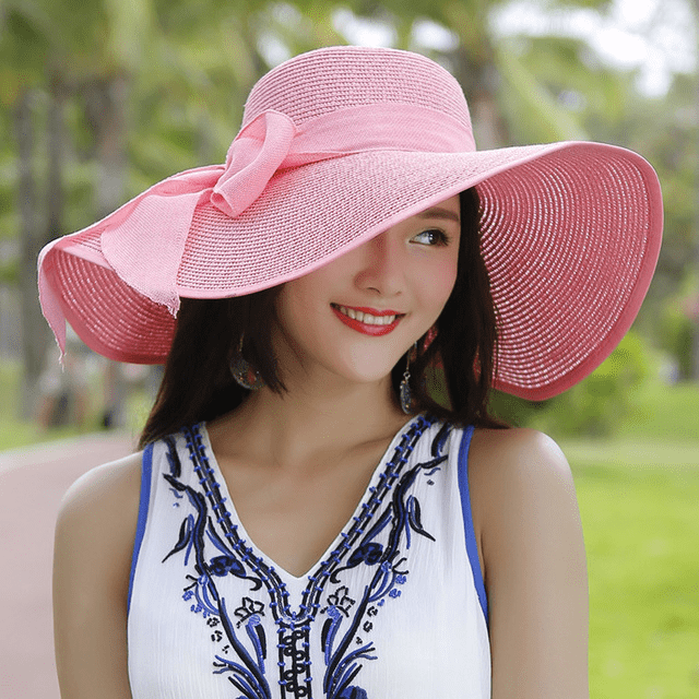 Women’s summer straw hat from Plush Fashion Hub, featuring wide brim and breathable woven design for sun protection.