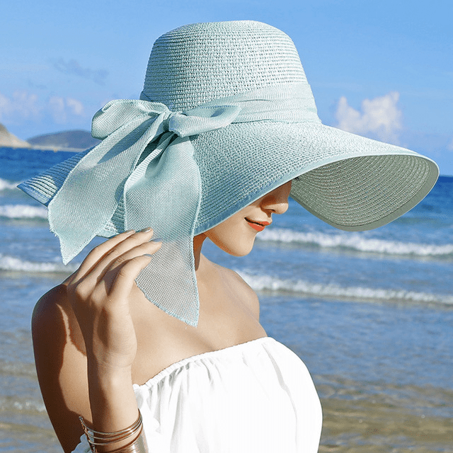 Women’s summer straw hat by Plush Fashion Hub featuring wide brim and classic woven design for sun protection and style.