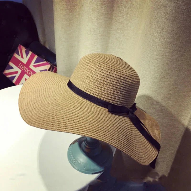 Women’s summer straw hat with wide brim and woven design from Plush Fashion Hub, perfect for sun protection and stylish outdoor wear.