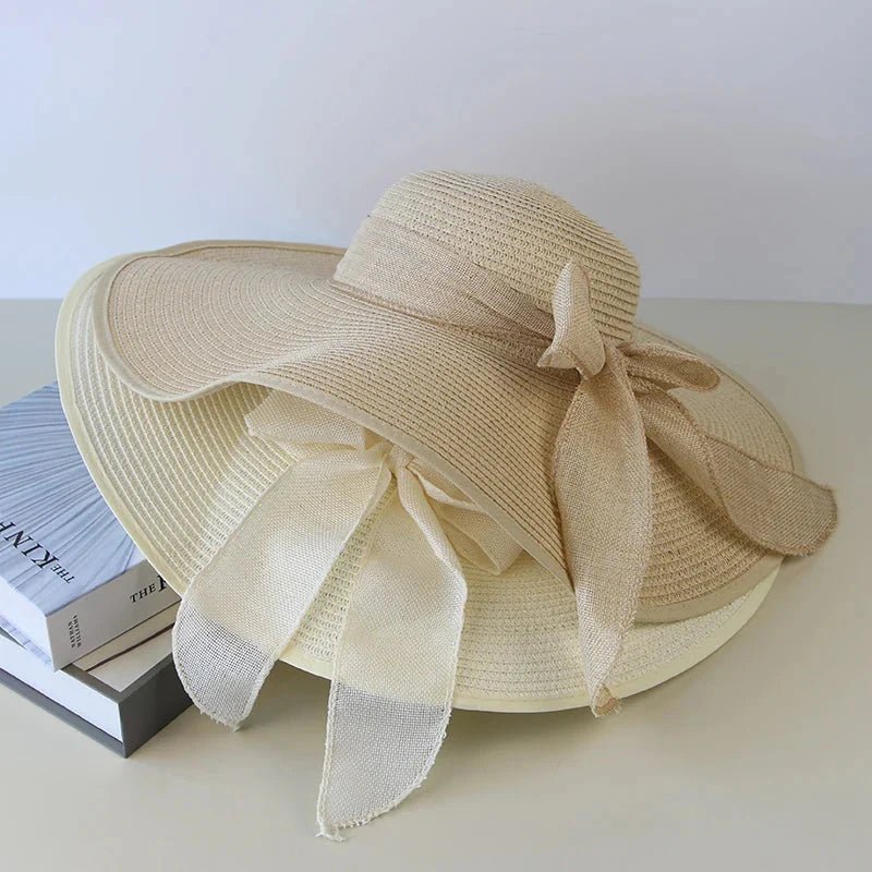 Women’s summer straw hat by Plush Fashion Hub featuring wide brim and woven straw design for sun protection and style.