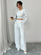Women’s tweed pearl-button jacket and pants set by Plush Fashion Hub, casualwear with stylish tweed fabric and elegant pearl buttons.