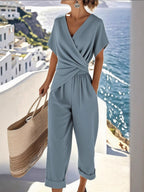 Plus size women's lounge set with twist-front V-neck top and matching pants with pockets by Plush Fashion Hub.