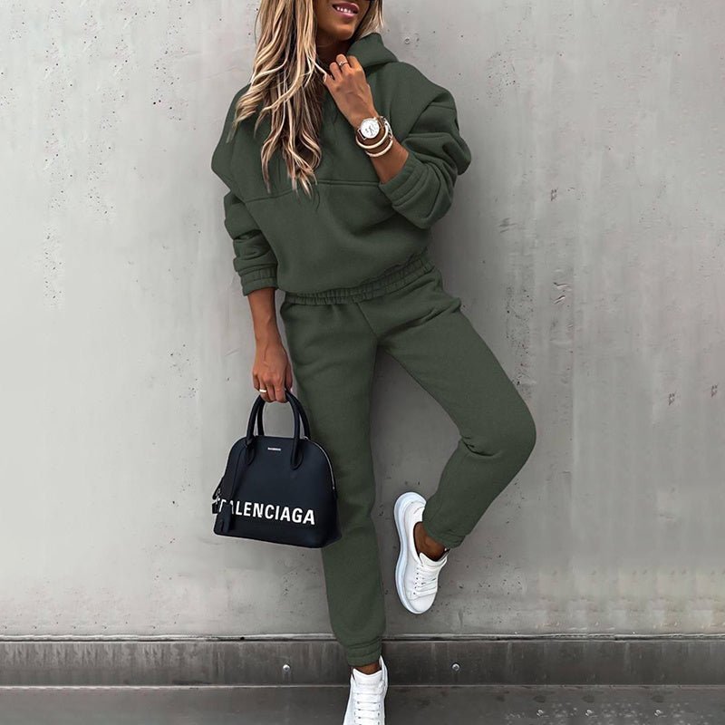 Women's two-piece solid color hooded sweatshirt set by Plush Fashion Hub, featuring a casual hoodie and matching pants.