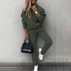 Women's two-piece solid color hooded sweatshirt set by Plush Fashion Hub, featuring a casual hoodie and matching pants.