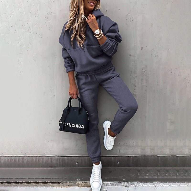 Women's two-piece solid color hooded sweatshirt set by Plush Fashion Hub, featuring a casual, comfortable design.
