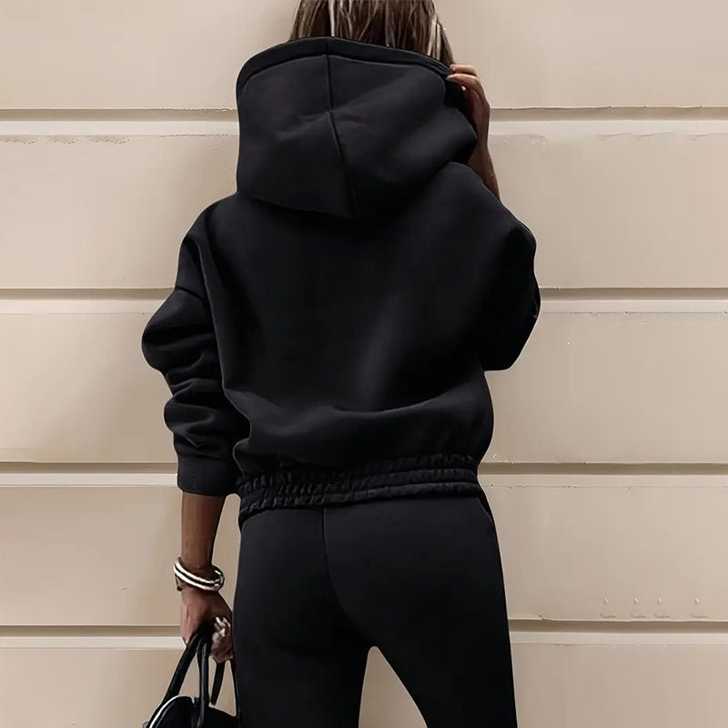 Women's two-piece solid color hooded sweatshirt set by Plush Fashion Hub, featuring a casual hoodie and matching sweatpants.
