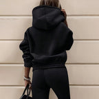 Women's two-piece solid color hooded sweatshirt set by Plush Fashion Hub, featuring a casual hoodie and matching sweatpants.