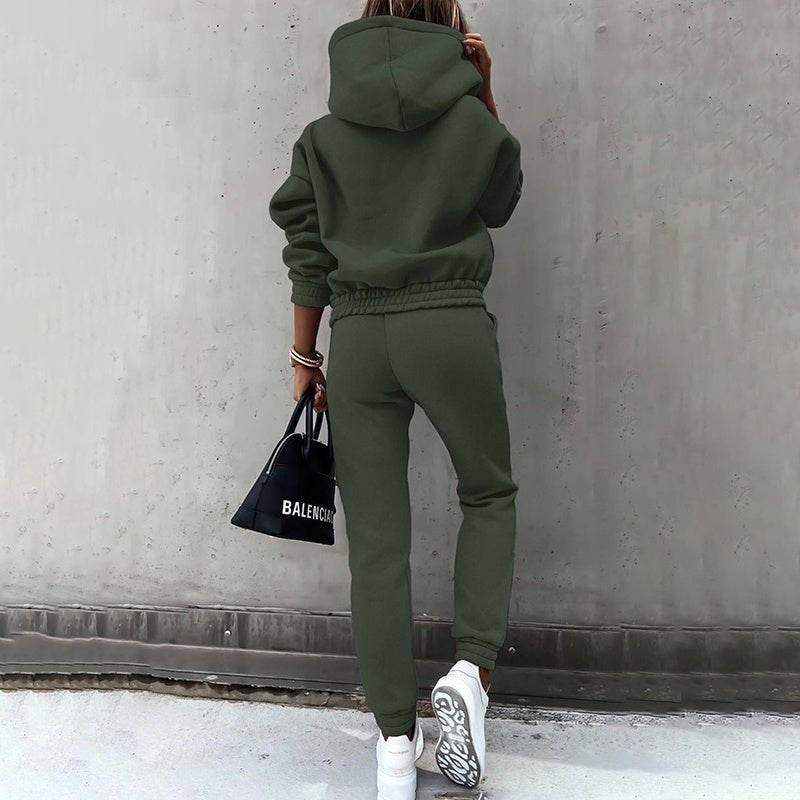 Women's two-piece solid color hooded sweatshirt set by Plush Fashion Hub, featuring a casual, comfortable hoodie and matching pants.