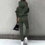 Women's two-piece solid color hooded sweatshirt set by Plush Fashion Hub, featuring a casual, comfortable hoodie and matching pants.