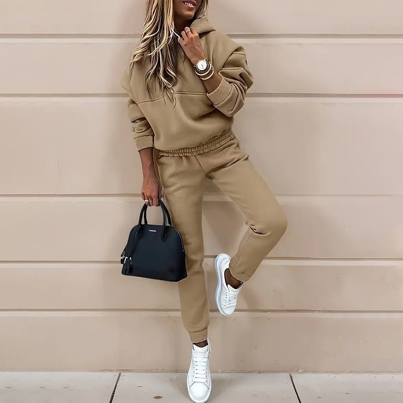Women’s two-piece solid color hooded sweatshirt set by Plush Fashion Hub, casualwear with a hooded top and matching bottoms.