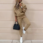 Women’s two-piece solid color hooded sweatshirt set by Plush Fashion Hub, casualwear with a hooded top and matching bottoms.
