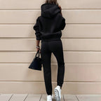 Women's two-piece solid color hooded sweatshirt set from Plush Fashion Hub, casualwear with a comfortable hooded top and matching pants.