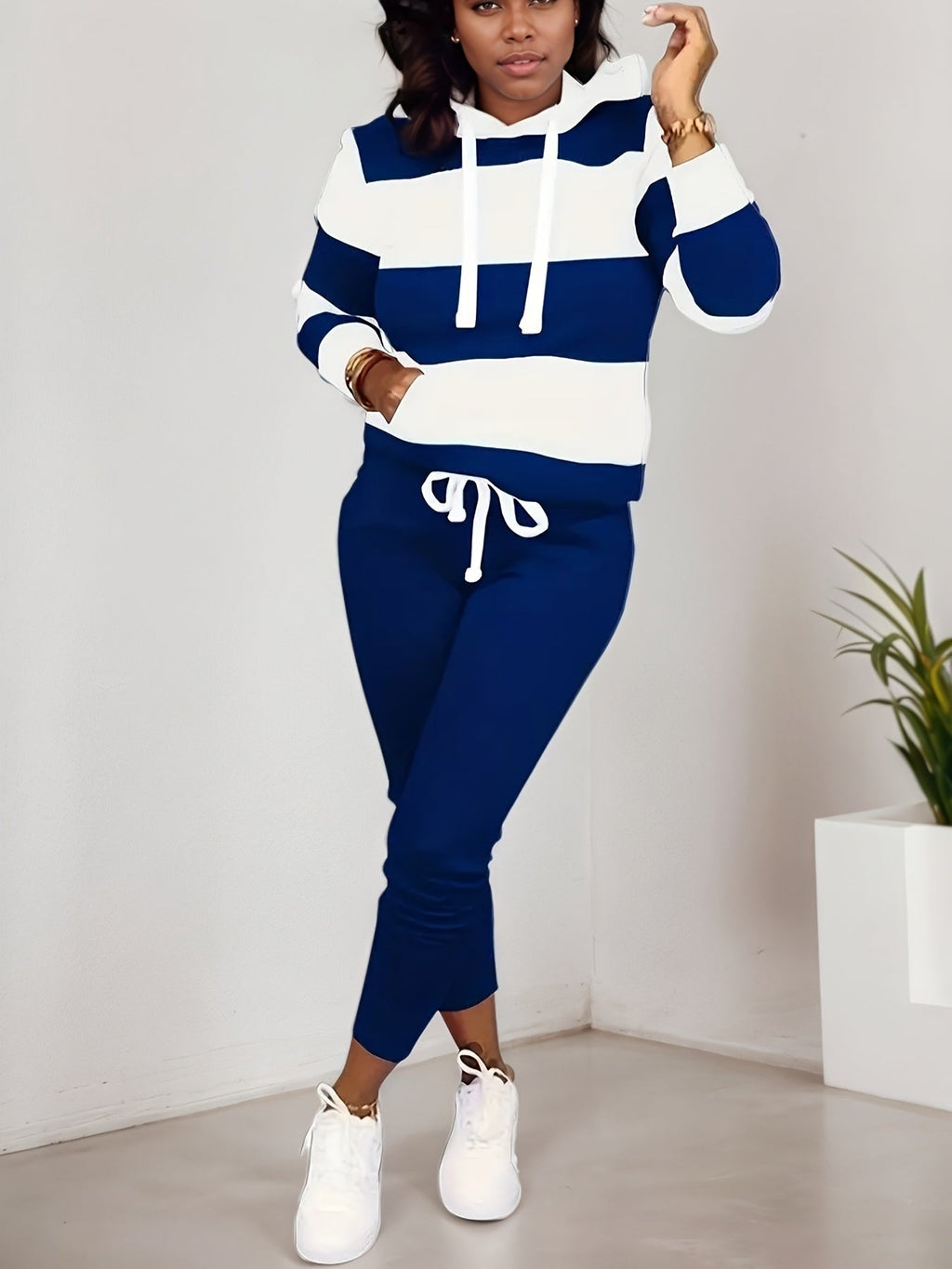 Women’s two-piece casual sportswear set by Plush Fashion Hub, featuring a sweatshirt and matching pants for comfortable style.