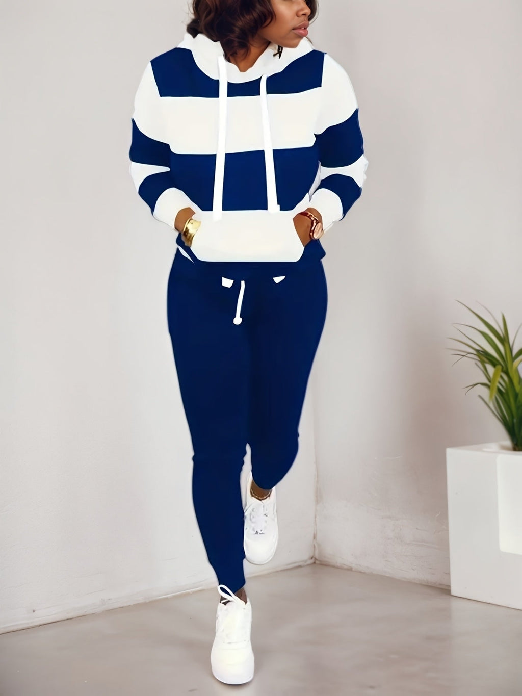 Women’s two-piece casual sportswear set by Plush Fashion Hub, featuring a sweatshirt and matching pants for comfortable style.