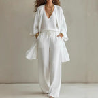 Women's V-neck cardigan coat, pocket vest, and long pants casualwear three-piece set by Plush Fashion Hub, displayed on a model.
