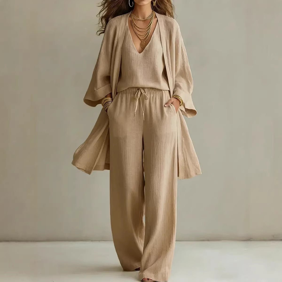 Women's V-neck cardigan coat, pocket vest, and long pants casualwear set by Plush Fashion Hub, shown on a model.