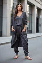 Women’s V-neck long sleeve solid color loose jumpsuit with two side pockets, casualwear by Plush Fashion Hub.