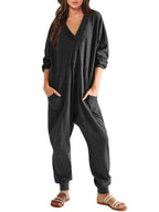 Women’s V-neck long sleeve solid color jumpsuit with side pockets, casualwear from Plush Fashion Hub, relaxed fit and comfortable style.