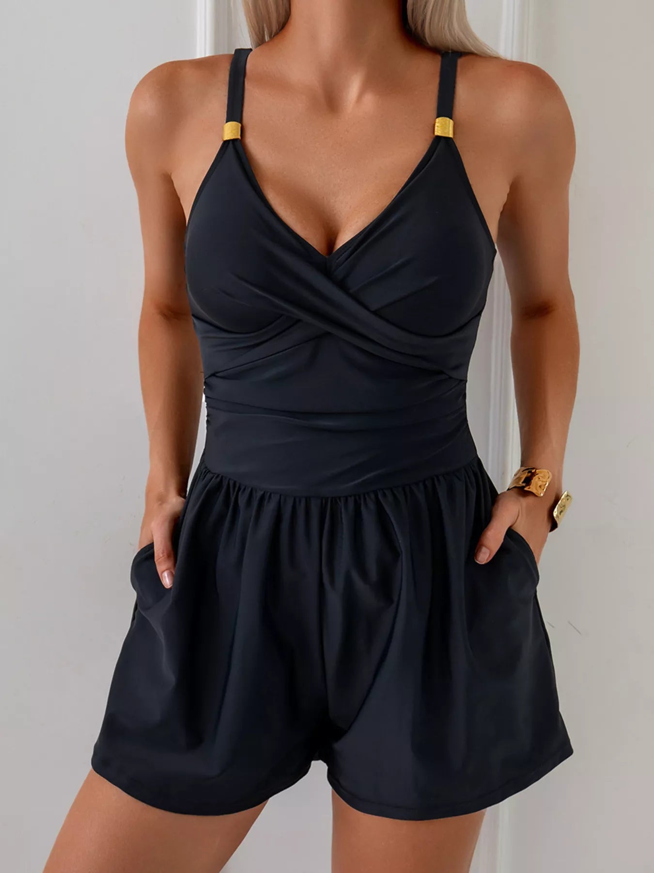 Women's V-Neck Spaghetti Strap One-Piece Swimsuit by Trendsi, featuring a stretchy fabric and sleek beachwear design.