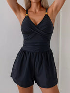 Women's V-neck spaghetti strap one-piece swimsuit by Trendsi, featuring stretchy fabric and stylish beachwear design.