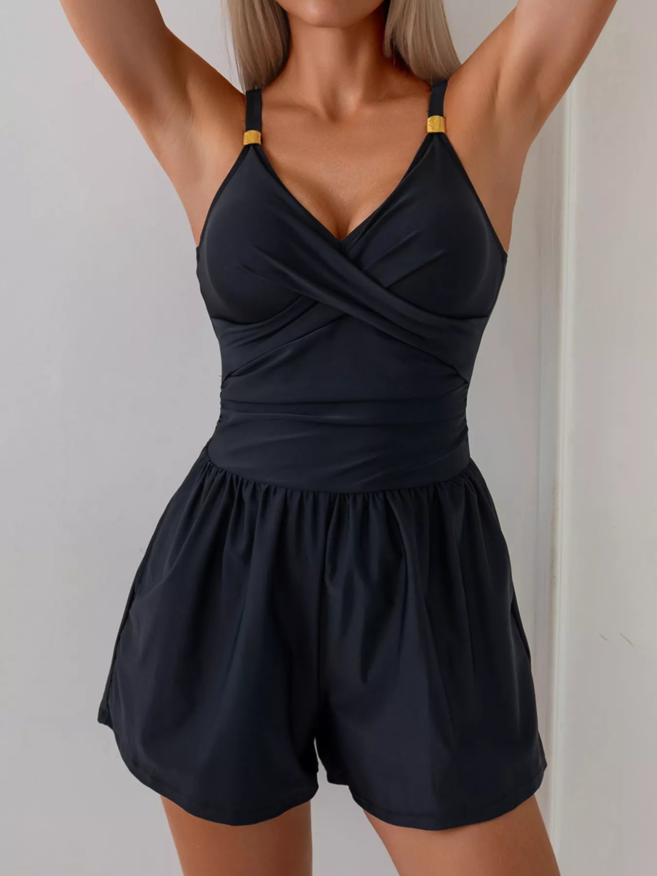 Women's V-neck spaghetti strap one-piece swimsuit by Trendsi, featuring stretchy fabric and stylish beachwear design.