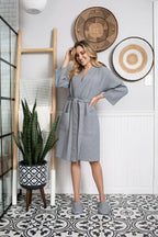 Knee-length waffle robe for women by Plush Fashion Hub, featuring soft fabric and a cozy, comfortable fit.