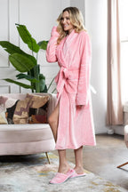 Women's ultra soft plush bathrobe from Plush Fashion Hub, shown hanging with a cozy, plush fabric and relaxed fit.