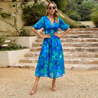 Summer floral V-neck dress for women by Dukun Design featuring a lightweight, flowy fabric with colorful floral patterns.