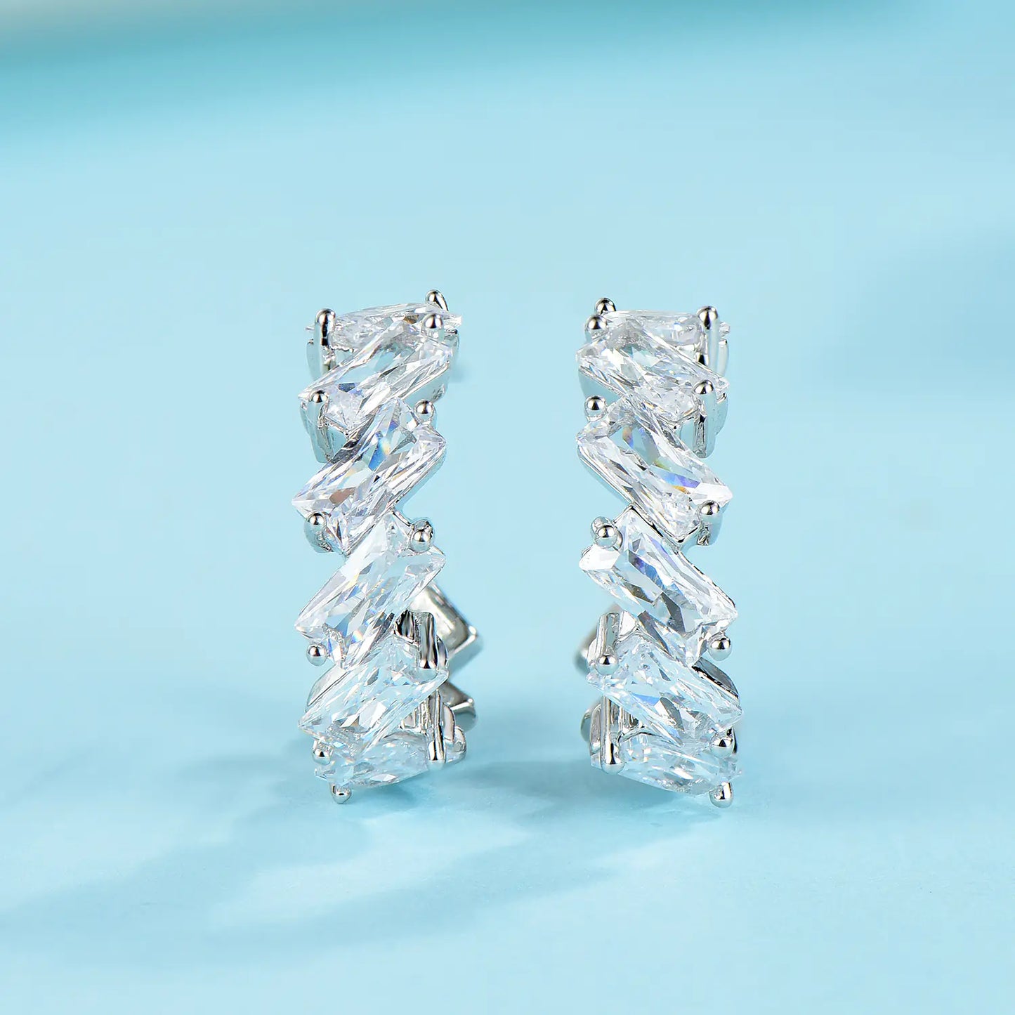 925 silver minimalist wave earrings and studs, featuring sleek, modern design perfect for everyday wear.