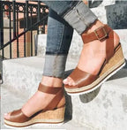 Women's wedge heel sandals with buckle detail, stylish Trendy Attic Store01 footwear, featuring open toe and ankle strap design.