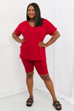 Women’s burgundy brushed V-neck lounge top and biker shorts set by Trendsi, comfortable casual women’s apparel.