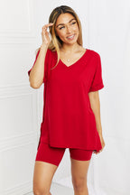 Women’s burgundy brushed V-neck lounge top and biker shorts set, comfortable casual wear from Trendsi.